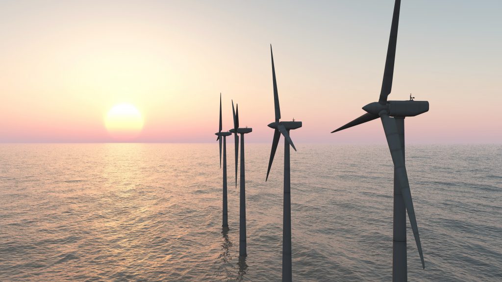 windmolens op zee bij zonsondergang
